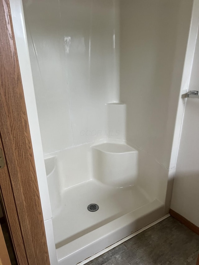 65 E N St, Newark, OH 43055 - full bathroom with a shower and baseboards