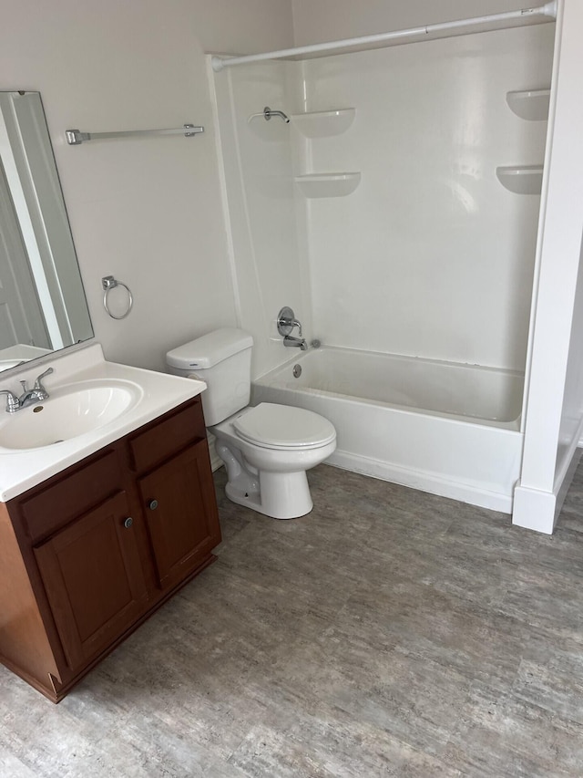 65 E N St, Newark, OH 43055 - bathroom with toilet, vanity, wood finished floors, and  shower combination