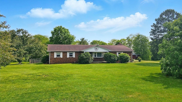 3865 Anderson Rd, Circleville, OH 43113 - single story home featuring a front lawn, brick siding, and a chimney