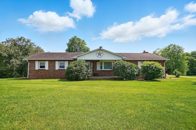 3865 Anderson Rd, Circleville, OH 43113 - ranch-style house with brick siding, a front lawn, and a chimney
