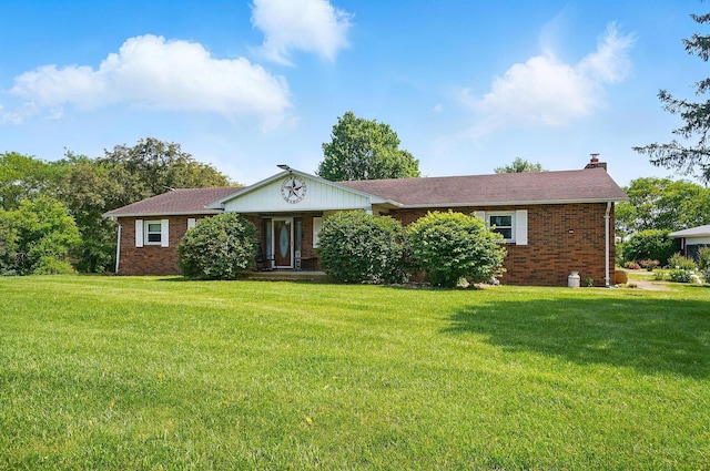 3865 Anderson Rd, Circleville, OH 43113 - ranch-style home featuring brick siding, a chimney, and a front lawn