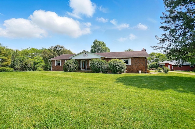 3865 Anderson Rd, Circleville, OH 43113 - ranch-style house with a front yard, brick siding, and a chimney