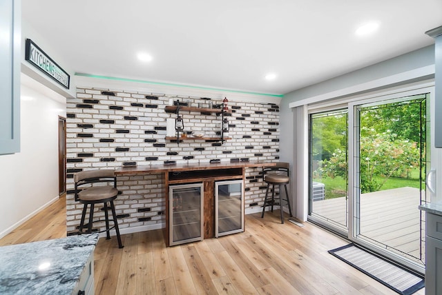 3865 Anderson Rd, Circleville, OH 43113 - indoor dry bar with wine cooler, light wood-type flooring, baseboards, and recessed lighting