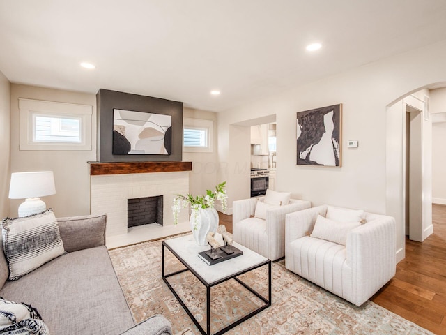 697 Stanley Ave, Columbus, OH 43206 - living area featuring arched walkways, plenty of natural light, wood finished floors, recessed lighting, and baseboards