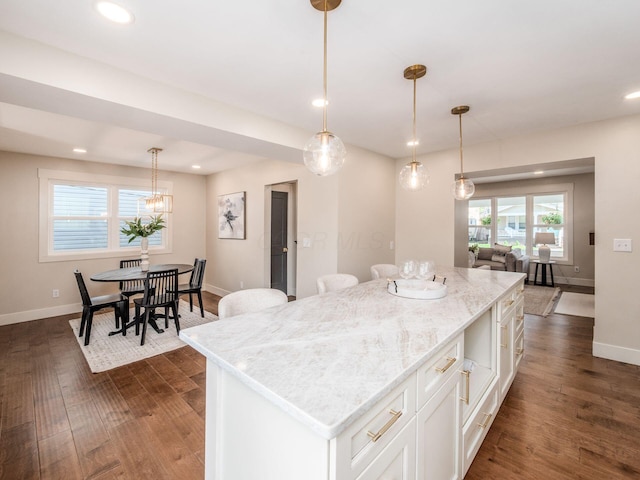 697 Stanley Ave, Columbus, OH 43206 - kitchen featuring white cabinetry, dark wood finished floors, a center island, baseboards, and recessed lighting