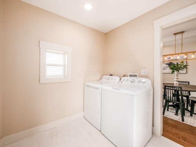 697 Stanley Ave, Columbus, OH 43206 - laundry area featuring washing machine and clothes dryer, baseboards, and recessed lighting