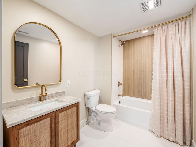 697 Stanley Ave, Columbus, OH 43206 - full bathroom with toilet, vanity, shower / bath combo, and baseboards