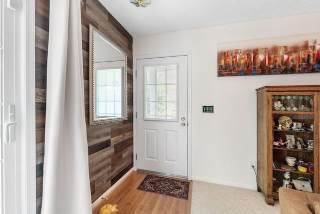 4642 Hobson Dr Unit 13E, Columbus, OH 43228 - entrance foyer with wood walls and baseboards