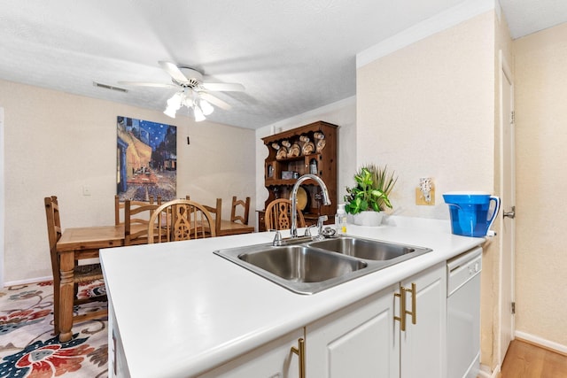 4642 Hobson Dr Unit 13E, Columbus, OH 43228 - kitchen with dishwasher, a sink, ceiling fan, light countertops, and a textured ceiling