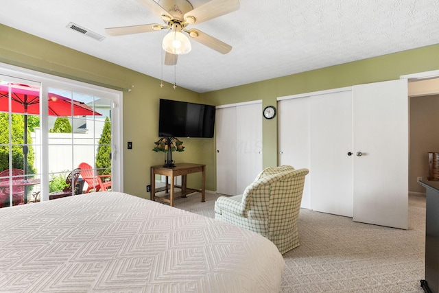 4642 Hobson Dr Unit 13E, Columbus, OH 43228 - carpeted bedroom featuring two closets and a ceiling fan
