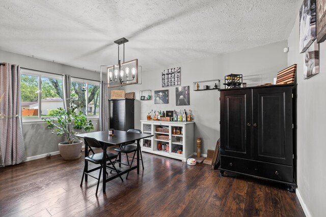 2923 Falcon Bridge Dr, Columbus, OH 43232 - dining room featuring baseboards, a textured ceiling, wood finished floors, and a chandelier
