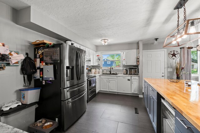 2923 Falcon Bridge Dr, Columbus, OH 43232 - kitchen featuring wood counters, range with electric cooktop, beverage cooler, stainless steel refrigerator with ice dispenser, and white cabinetry
