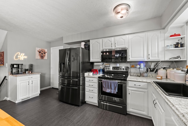 2923 Falcon Bridge Dr, Columbus, OH 43232 - kitchen with stainless steel appliances, a textured ceiling, a sink, white cabinetry, and open shelves