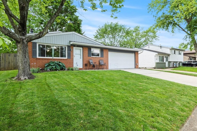 2923 Falcon Bridge Dr, Columbus, OH 43232 - tri-level home with concrete driveway, brick siding, a garage, and board and batten siding