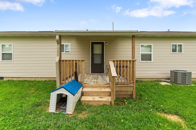 145 Sara Ave, Marion, OH 43302 - back of house with central AC unit, a wooden deck, and a yard