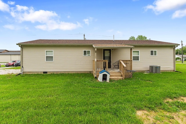 145 Sara Ave, Marion, OH 43302 - rear view of property featuring cooling unit, a lawn, and a deck