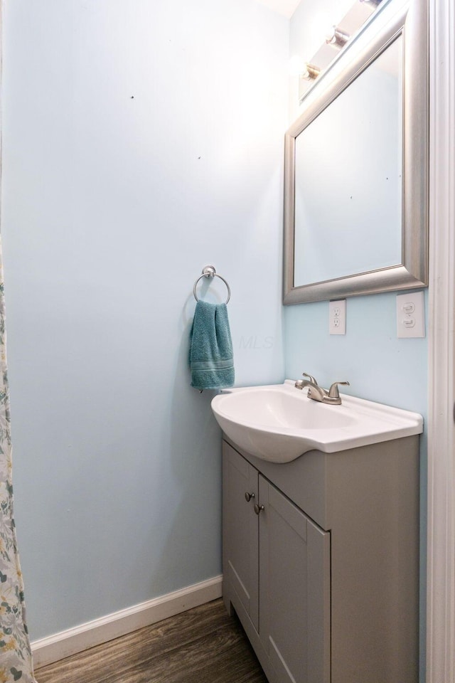 145 Sara Ave, Marion, OH 43302 - bathroom with wood finished floors, vanity, and baseboards
