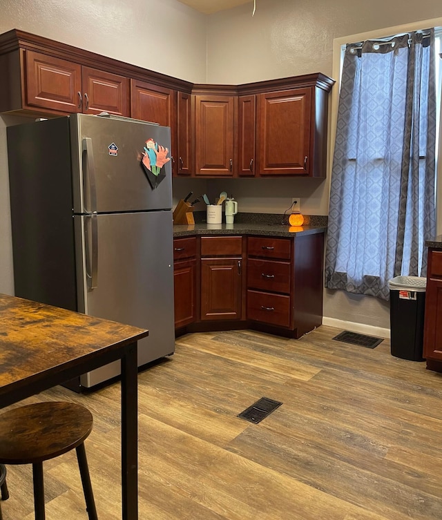 130 N 4th St, Greenfield, OH 45123 - kitchen featuring freestanding refrigerator and light wood-style flooring