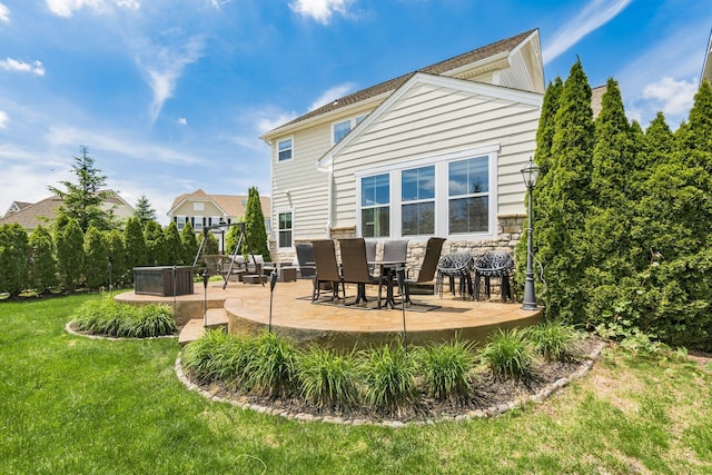 7834 Avaleen Cir N, Dublin, OH 43016 - rear view of property with a patio area, a lawn, and stone siding