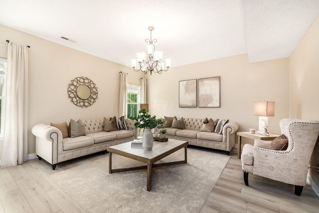 7834 Avaleen Cir N, Dublin, OH 43016 - living area featuring a chandelier and light wood-style flooring