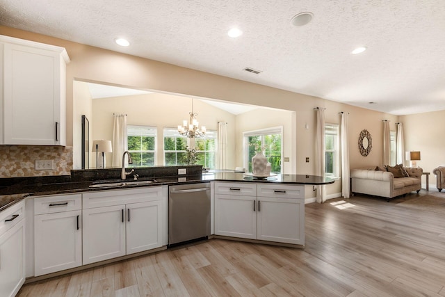 7834 Avaleen Cir N, Dublin, OH 43016 - kitchen featuring stainless steel dishwasher, a sink, light wood-style floors, a chandelier, and plenty of natural light