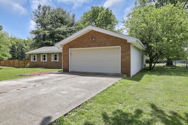 single story home with brick siding, a garage, and driveway