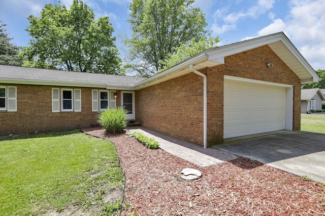 ranch-style house featuring brick siding, a garage, concrete driveway, and a front lawn