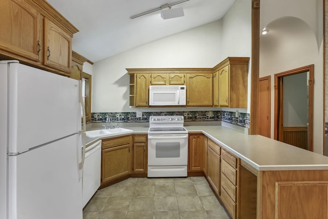 kitchen with white appliances, vaulted ceiling, a peninsula, a sink, and light countertops