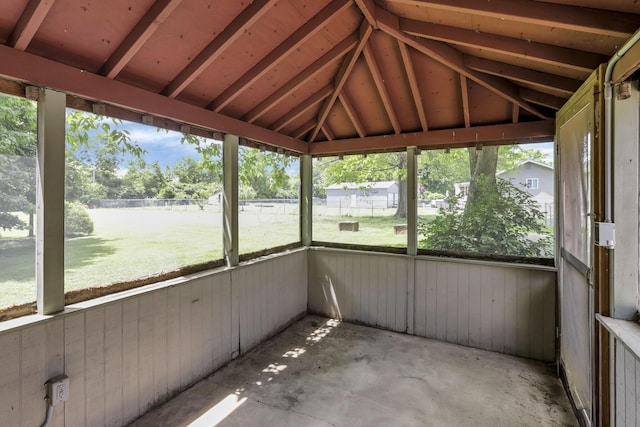 unfurnished sunroom with vaulted ceiling