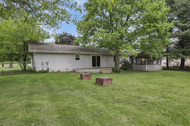 back of property with a sunroom