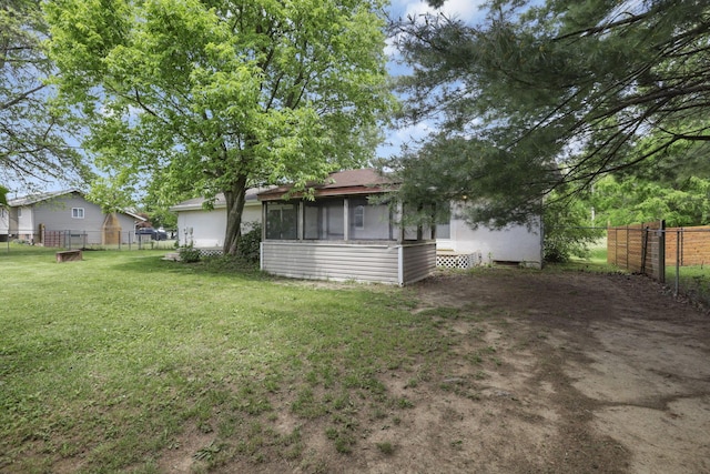 view of yard with a sunroom