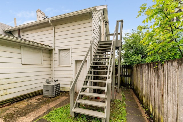 281 E Central Ave, Delaware, OH 43015 - view of side of home with stairs, central air condition unit, and a chimney