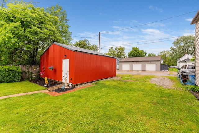 281 E Central Ave, Delaware, OH 43015 - view of yard with a garage and an outbuilding