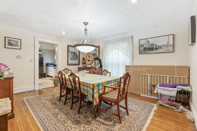 281 E Central Ave, Delaware, OH 43015 - dining space with a textured ceiling, light wood-style floors, recessed lighting, and baseboards