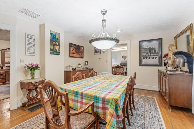 281 E Central Ave, Delaware, OH 43015 - dining space with light wood-style floors, baseboards, and recessed lighting