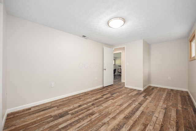 1366 Dyer Rd, Grove City, OH 43123 - empty room featuring baseboards, wood finished floors, and a textured ceiling