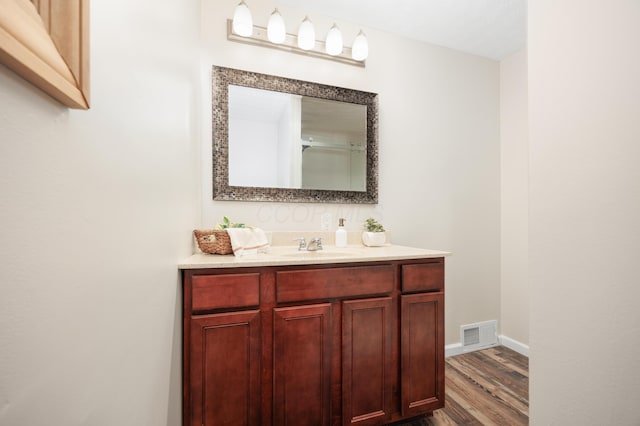 1366 Dyer Rd, Grove City, OH 43123 - bathroom with wood finished floors, vanity, and baseboards