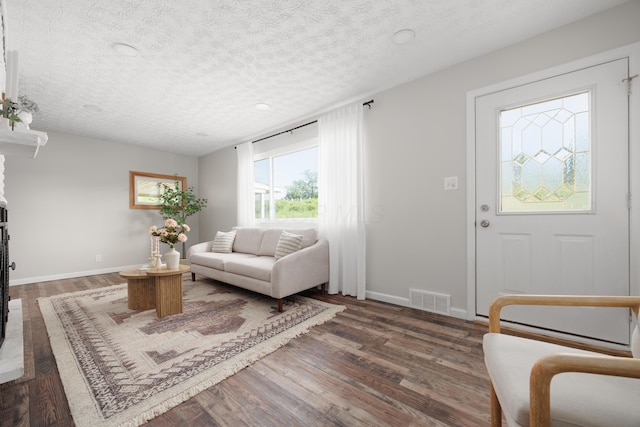1366 Dyer Rd, Grove City, OH 43123 - living area featuring a textured ceiling, baseboards, and wood finished floors