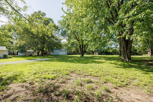 1366 Dyer Rd, Grove City, OH 43123 - view of grassy yard with a garage
