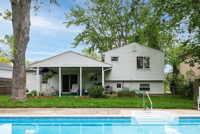 5965 Lucky Charm Dr, Galloway, OH 43119 - rear view of house featuring an outdoor pool