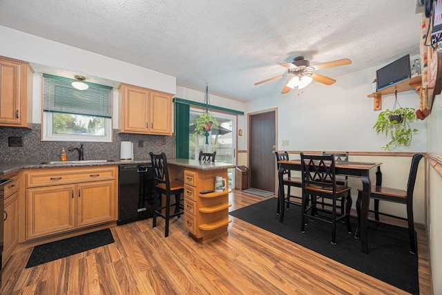 5965 Lucky Charm Dr, Galloway, OH 43119 - kitchen featuring black dishwasher, a sink, open shelves, light wood-style flooring, and ceiling fan