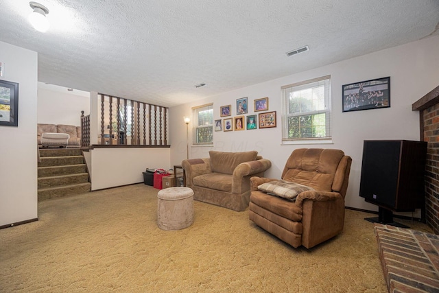 5965 Lucky Charm Dr, Galloway, OH 43119 - living room featuring carpet, a textured ceiling, and stairs