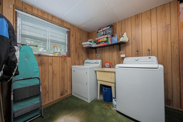 5965 Lucky Charm Dr, Galloway, OH 43119 - laundry room with independent washer and dryer, wooden walls, and dark colored carpet