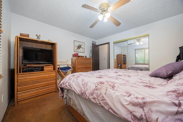 5965 Lucky Charm Dr, Galloway, OH 43119 - bedroom with carpet flooring, a closet, a textured ceiling, and a ceiling fan