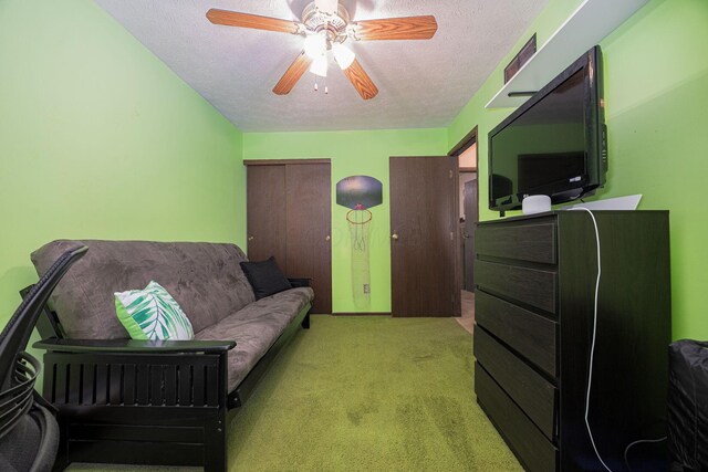 5965 Lucky Charm Dr, Galloway, OH 43119 - living area with a textured ceiling, a ceiling fan, and carpet