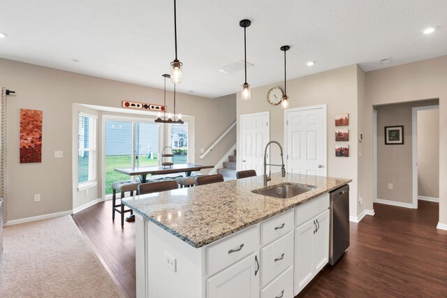 7540 Twisted Bark Dr, Canal Winchester, OH 43110 - kitchen featuring stainless steel dishwasher, recessed lighting, pendant lighting, light stone counters, and white cabinets