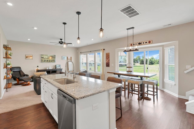 7540 Twisted Bark Dr, Canal Winchester, OH 43110 - kitchen featuring stainless steel dishwasher, recessed lighting, white cabinets, dark wood finished floors, and open floor plan
