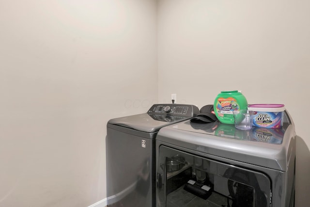 7540 Twisted Bark Dr, Canal Winchester, OH 43110 - laundry area featuring washer and dryer and tile patterned flooring