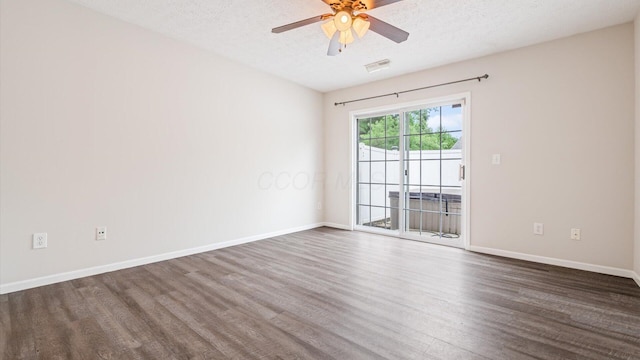 6706 Axtel Dr Unit 7A, Canal Winchester, OH 43110 - spare room featuring dark wood-style flooring, a ceiling fan, baseboards, and a textured ceiling