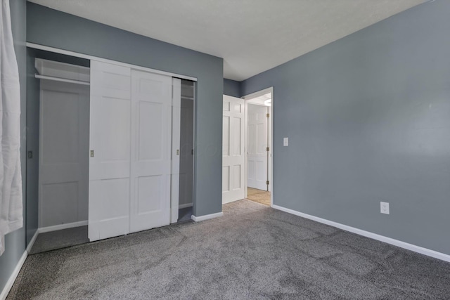 625 Country Club Dr Unit E4, Newark, OH 43055 - unfurnished bedroom featuring carpet flooring, baseboards, and a closet